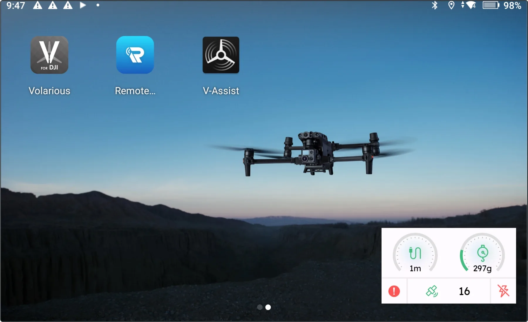 The device launcher showing the Volarious and V-Assist app icons side by side, with V-Assist’s floating telemetry widget pinned over the wallpaper showing tether length, tension and satellite count.