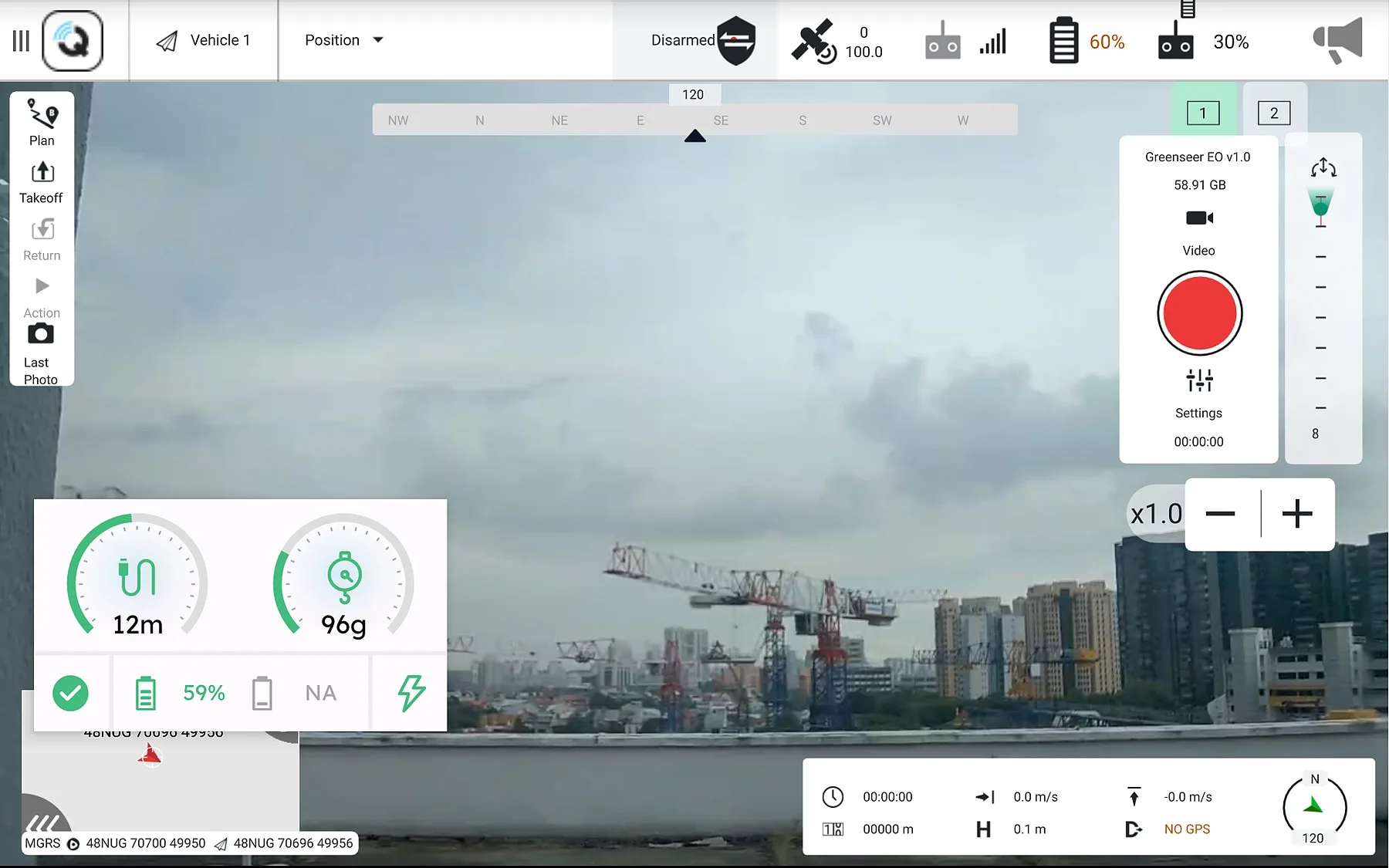 V-Assist flight view: live drone camera feed over a Singapore construction site, with tether length and tension gauges overlaid alongside takeoff, plan and return controls.
